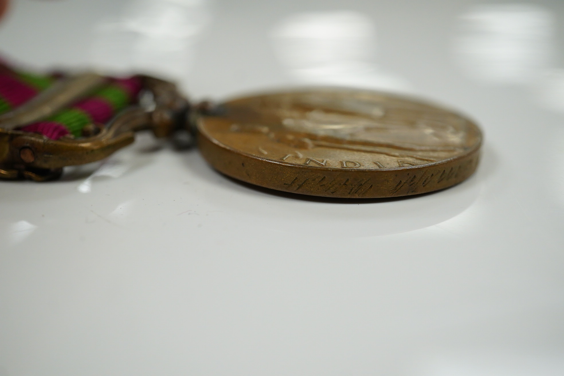 Two India Medals; one with Tirah 1897-98 clasp, naming worn/erased, the other in bronze with Punjab Frontier 1897-98 clasp to ...Transport Dept